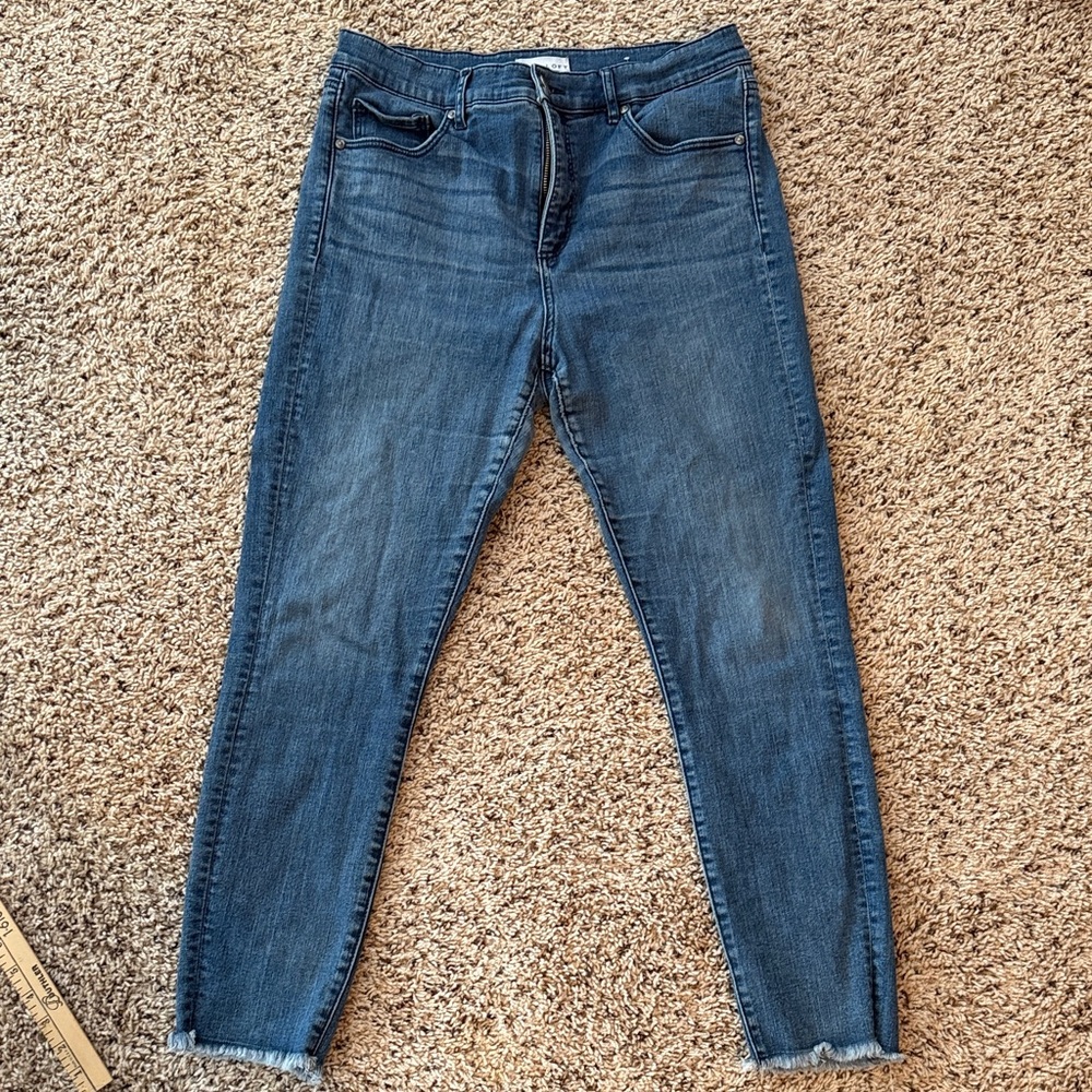 Loft Size 10/30 high waisted skinny jean with distressed leg bottom